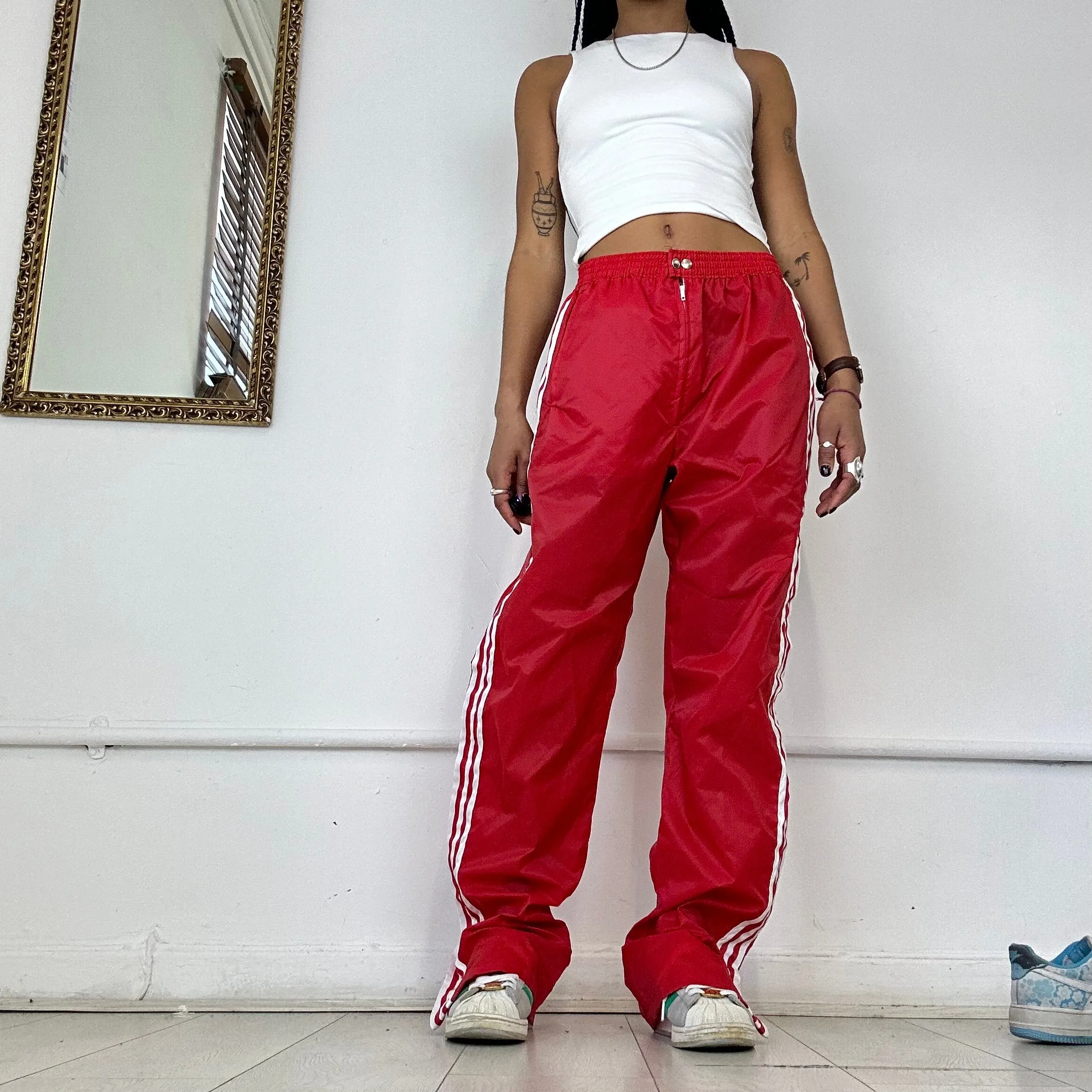 red adidas three stripe joggers