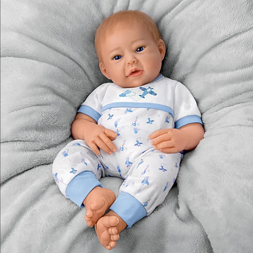 The Ashton - Drake Galleries New To The Crew Baby Boy Doll Weighted Poseable TrueTouch® Authentic Silicone with Helicopter Pacifier and Outfit by Michelle Fagan 18-inches
