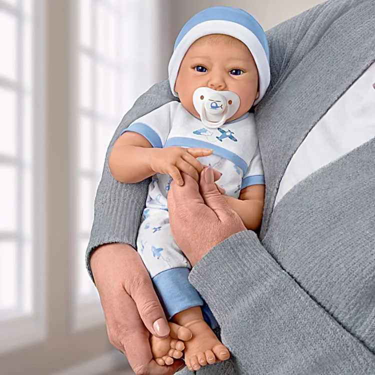 The Ashton - Drake Galleries New To The Crew Baby Boy Doll Weighted Poseable TrueTouch® Authentic Silicone with Helicopter Pacifier and Outfit by Michelle Fagan 18-inches