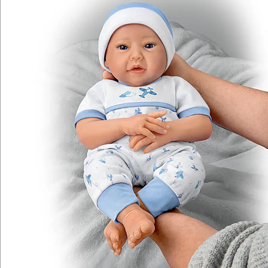 The Ashton - Drake Galleries New To The Crew Baby Boy Doll Weighted Poseable TrueTouch® Authentic Silicone with Helicopter Pacifier and Outfit by Michelle Fagan 18-inches