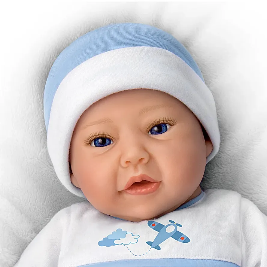 The Ashton - Drake Galleries New To The Crew Baby Boy Doll Weighted Poseable TrueTouch® Authentic Silicone with Helicopter Pacifier and Outfit by Michelle Fagan 18-inches